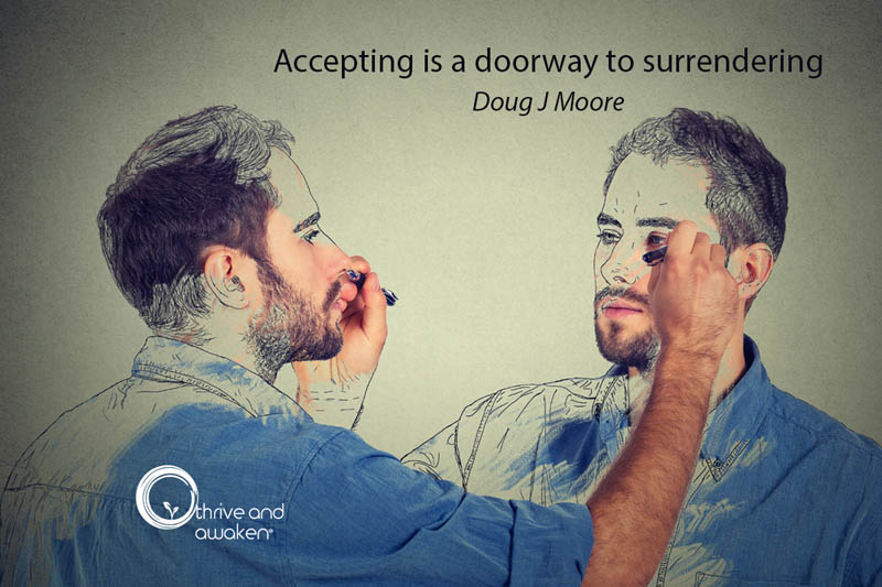 A man looking into a mirror drawing himself